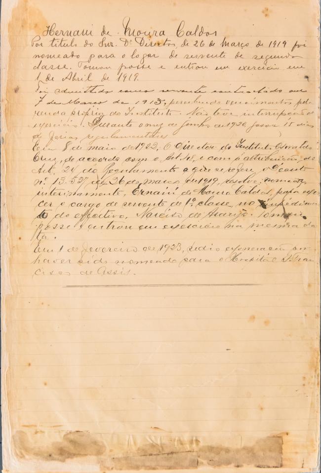 Ficha de registro funcional de Ernani de Moura Caldas. Documento manuscrito